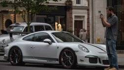 370CB8AE00000578-3733014-A_man_stops_to_take_a_photo_of_a_100_000_white_Porsche_GT3_which-a-183_1470841210468.jpg