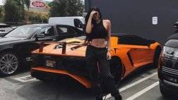 kylie-jenner-sits-on-engine-deck-of-ferrari-488-spider-with-aventador-sv-behind_3.jpg