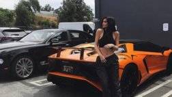 kylie-jenner-sits-on-engine-deck-of-ferrari-488-spider-with-aventador-sv-behind_4.jpg